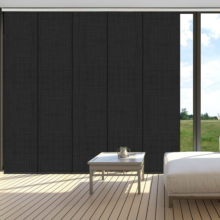 Blackout sliding panel blinds covering large sliding glass door with modern track system for privacy and light control