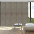 Blackout cordless sliding panel blinds covering large window with modern vertical design