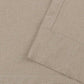 Pair of black faux linen blackout curtains with pencil pinch pleats blocking light and insulating thermal energy