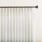 Set of 2 semi-sheer faux linen pinch pleat curtains with custom length, UV protection, and machine washable fabric