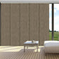 Blackout cordless sliding panel blinds covering large window in modern room